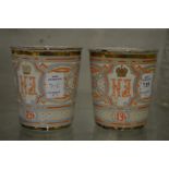 A pair of enamel commemorative beakers.