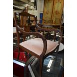 An Edwardian inlaid mahogany armchair.