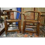 A pair of Chinese horseshoe shaped armchairs.