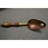 A 19th century brass, copper and turned wood powder scoop.