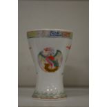 A Chinese porcelain cup decorated with dragons and phoenix.