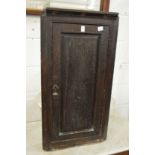 An old oak hanging corner cupboard.