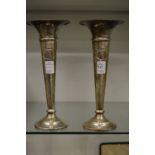 A pair of silver trumpet shaped vases.
