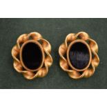 A pair of Lisa Jones gilt and black stone earrings.