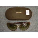 A pair of Tom Ford sunglasses in original case.