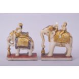 A PAIR OF 19TH CENTURY INDIAN CARVED POLYCHROME ALABASTER ELEPHANTS AND RIDERS, (one with damage),