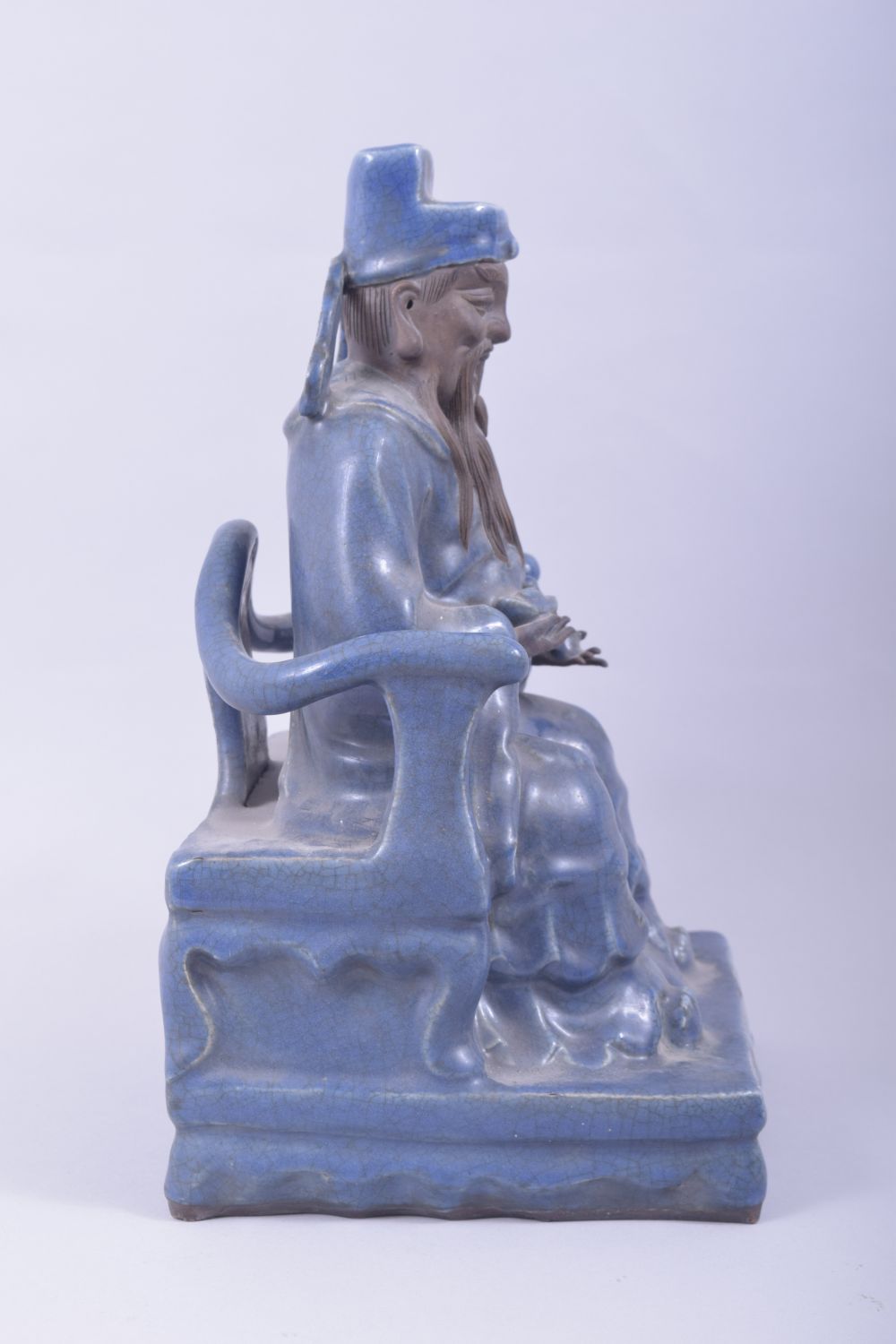 A LARGE CHINESE POWDER BLUE GLAZE POTTERY SEATED FIGURE of a god, the figure seated upon a throne - Image 2 of 8