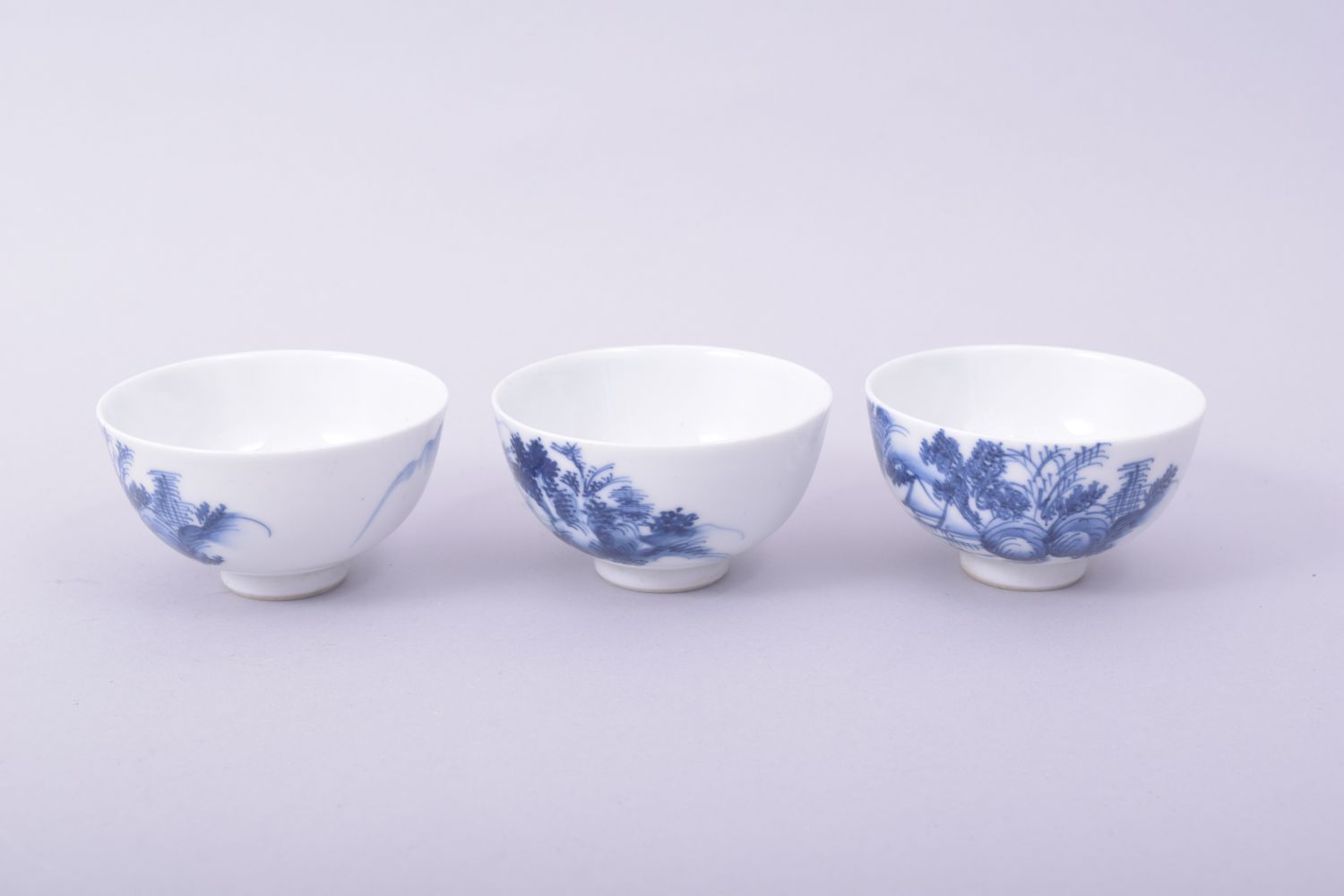 THREE CHINESE BLUE AND WHITE PORCELAIN TEA BOWLS, each painted with a landscape scene, 7.5cm - Image 2 of 6