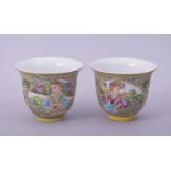 A PAIR CHINESE / EUROPEAN FAMILLE JAUNE PORCELAIN CUPS, decorated with panels of figures, each