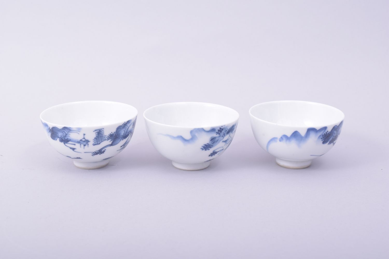 THREE CHINESE BLUE AND WHITE PORCELAIN TEA BOWLS, each painted with a landscape scene, 7.5cm - Image 4 of 6