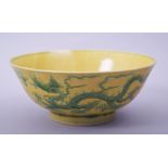 A CHINESE YELLOW GROUND PORCELAIN DRAGON BOWL, with incised green dragons and clouds to the