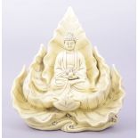 A LARGE BLANC DE CHINE PORCELAIN GUANYIN SITTING ON A LOTUS, the reverse with two marks, 32cm high.