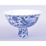A CHINESE BLUE AND WHITE PORCELAIN STEM CUP, the bowl painted with kylin and foliate decoration, the