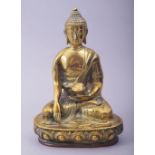 A CHINESE BRASS MODEL OF BUDDHA, 19cm high.