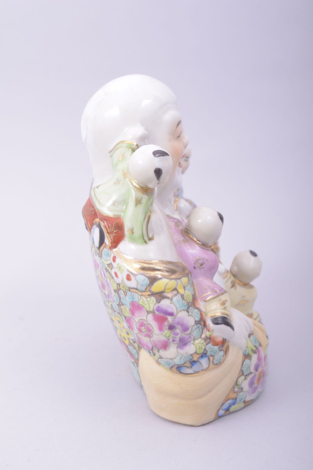 A CHINESE PORCELAIN LAUGHING BUDDHA, with five children, 15cm high. - Image 4 of 7