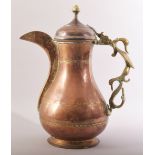 A LARGE INDIAN COPPER BRASS COFFEE POT, with zoomorphic handle, 35.5cm high.