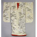 A SUPERB LARGE CREAM GROUND SILK AND SILVER COLOUR THREAD KIMONO, embroidered with cranes in a