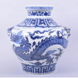 A LARGE CHINESE BLUE AND WHITE GLAZED POTTERY URN / VASE, the body painted with a dragon amongst