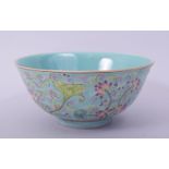 A CHINESE TURQUOISE GROUND FAMILLE ROSE PORCELAIN BOWL, the exterior decorated with flora, with