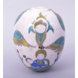 A TURKISH ARMENIAN GLAZED POTTERY HANGING EGG FORM ORNAMENT, painted with the virgin and child, 9.