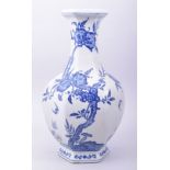 A LARGE CHINESE BLUE AND WHITE PORCELAIN HEXAGONAL VASE, decorated with peach blossom, the base with