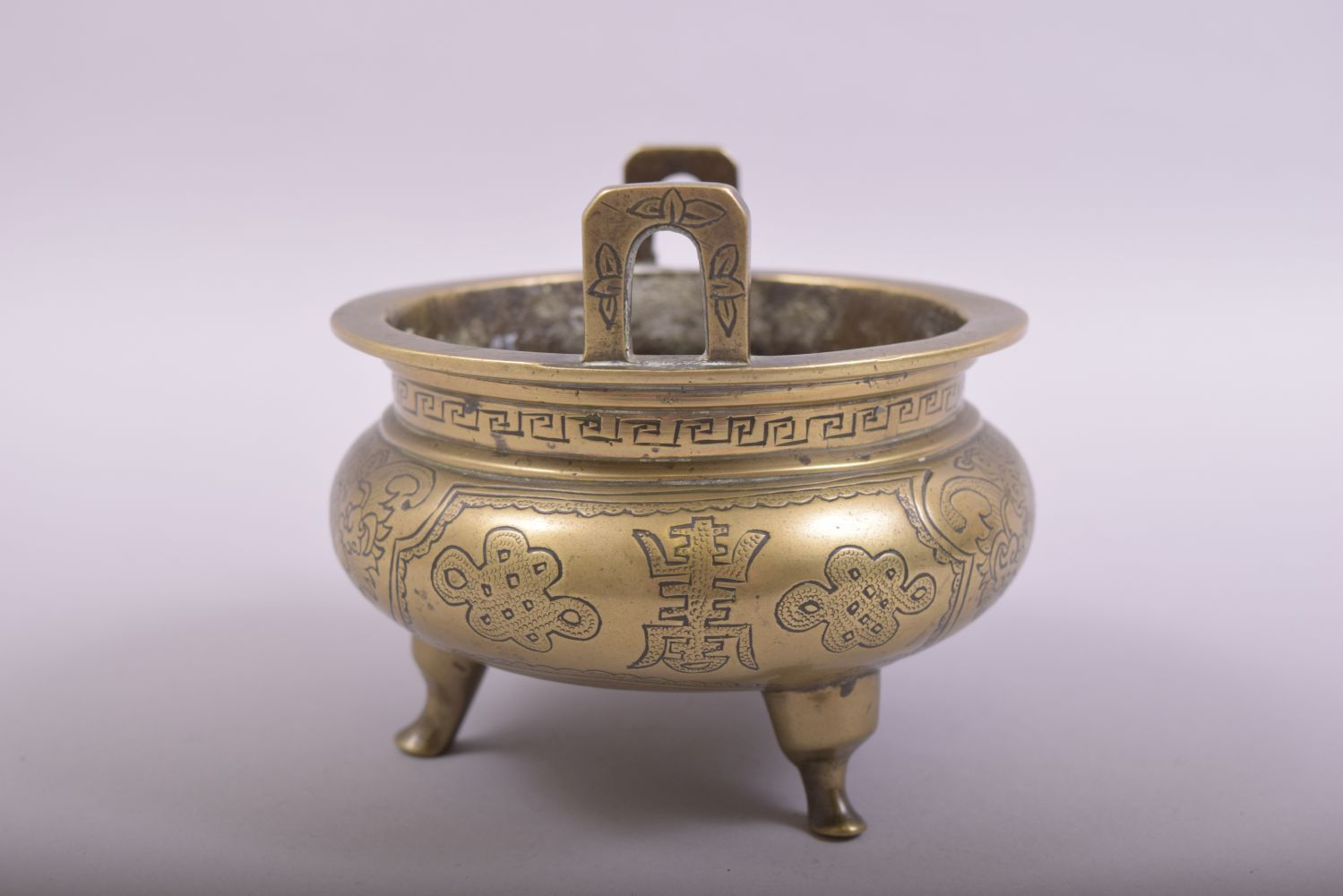 A CHINESE BRONZE TWIN HANDLE TRIPOD CENSER, with engraved and chased decoration, the base with six- - Image 2 of 7