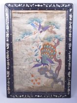 A CHINESE FRAMED EMBROIDERED PICTURE PANEL, embroidered with a peacock and flora, the hardwood frame