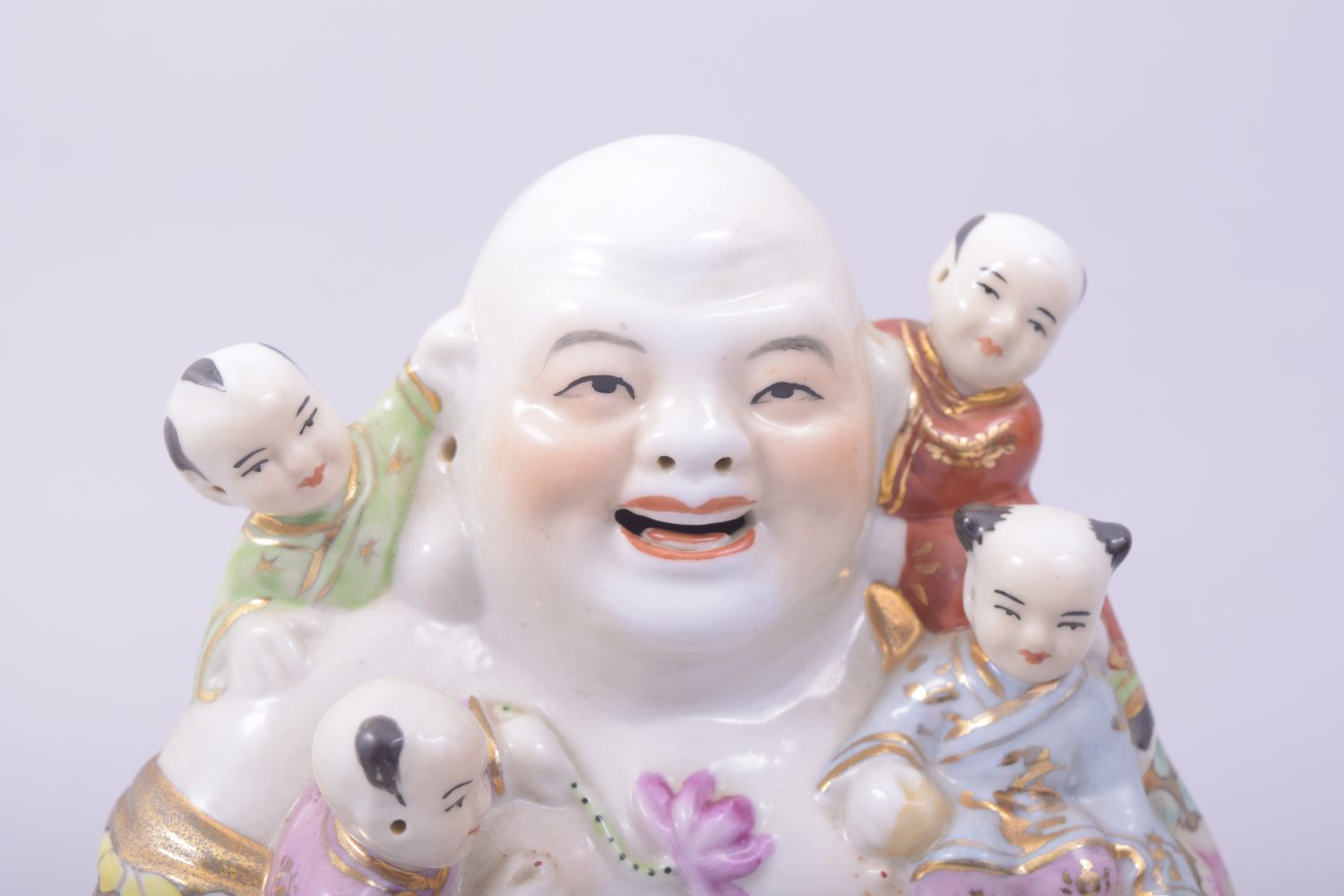 A CHINESE PORCELAIN LAUGHING BUDDHA, with five children, 15cm high. - Image 5 of 7