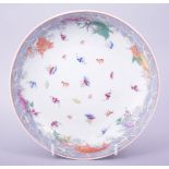 A CHINESE PORCELAIN DRAGON AND BAT DISH, painted with numerous bats amongst stylised clouds and