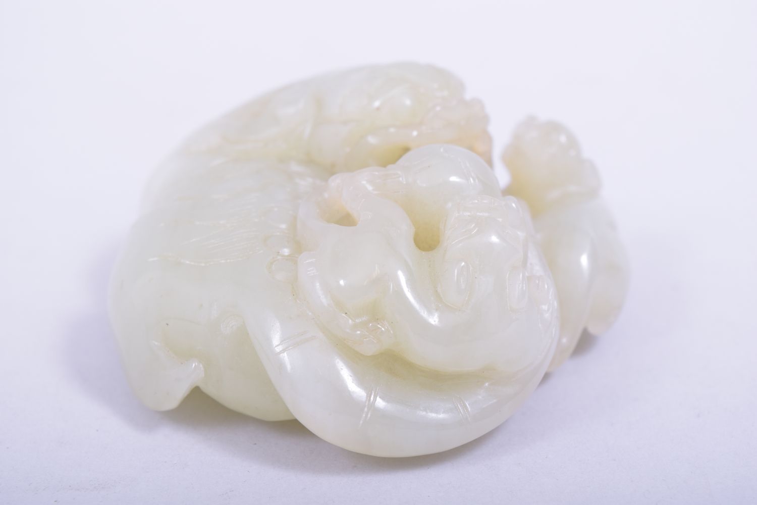 A CHINESE QING DYNASTY CELADON JADE CARVED THREE LIONS, on a fitted hardwood stand, jade 9cm x 8. - Image 5 of 7