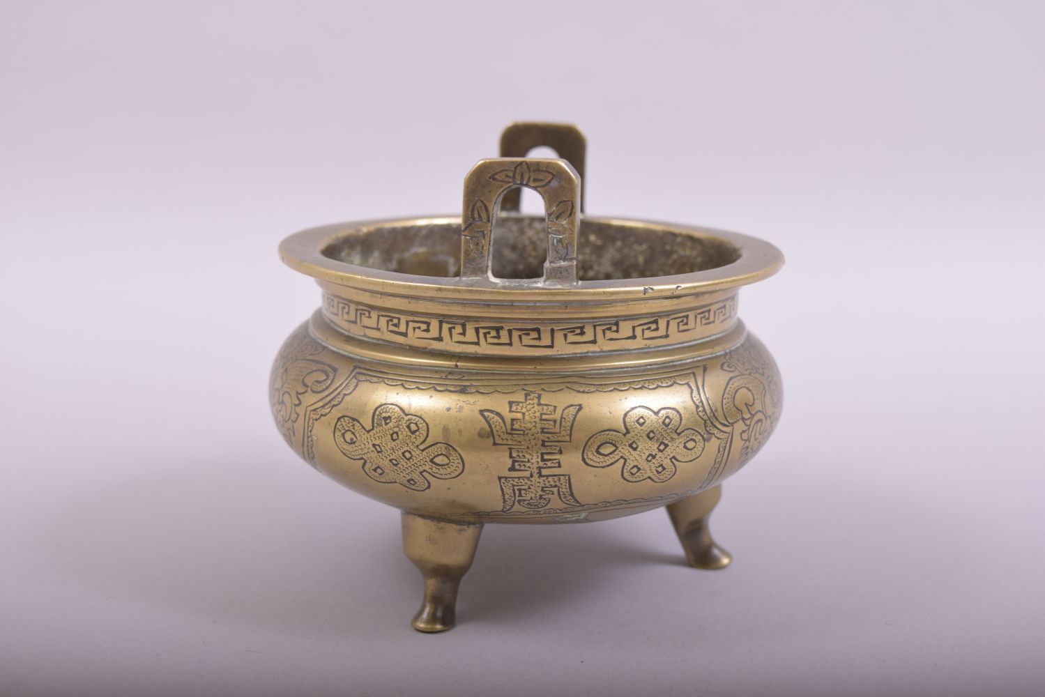 A CHINESE BRONZE TWIN HANDLE TRIPOD CENSER, with engraved and chased decoration, the base with six- - Image 4 of 7