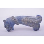 AN ISLAMIC CARVED LAPIS LAZULI DAGGER HILT, carved in the form of tiger head with floral decoration,