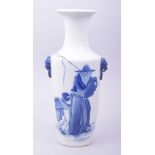 AN EARLY 20TH CENTURY BLUE AND WHITE PORCELAIN TWIN HANDLE VASE, the body painted with a figure