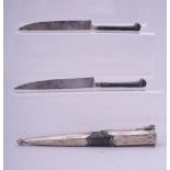 A RARE 18TH CENTURY OTTOMAN SILVER MOUNTED TROUSE, the two knives with black coral handles and