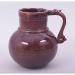 A CHINESE OX BLOOD GLAZE PORCELAIN JUG, with incised decoration under glaze depicting dragon and