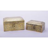 TWO ISLAMIC BRASS LIDDED BOXES, with hinged lids and each engraved with calligraphy and decorative