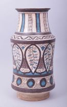 AN ISLAMIC POTTERY MEDICINE JAR, with a central band of stylised leaf pattern and other motifs, 26cm