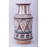 AN ISLAMIC POTTERY MEDICINE JAR, with a central band of stylised leaf pattern and other motifs, 26cm