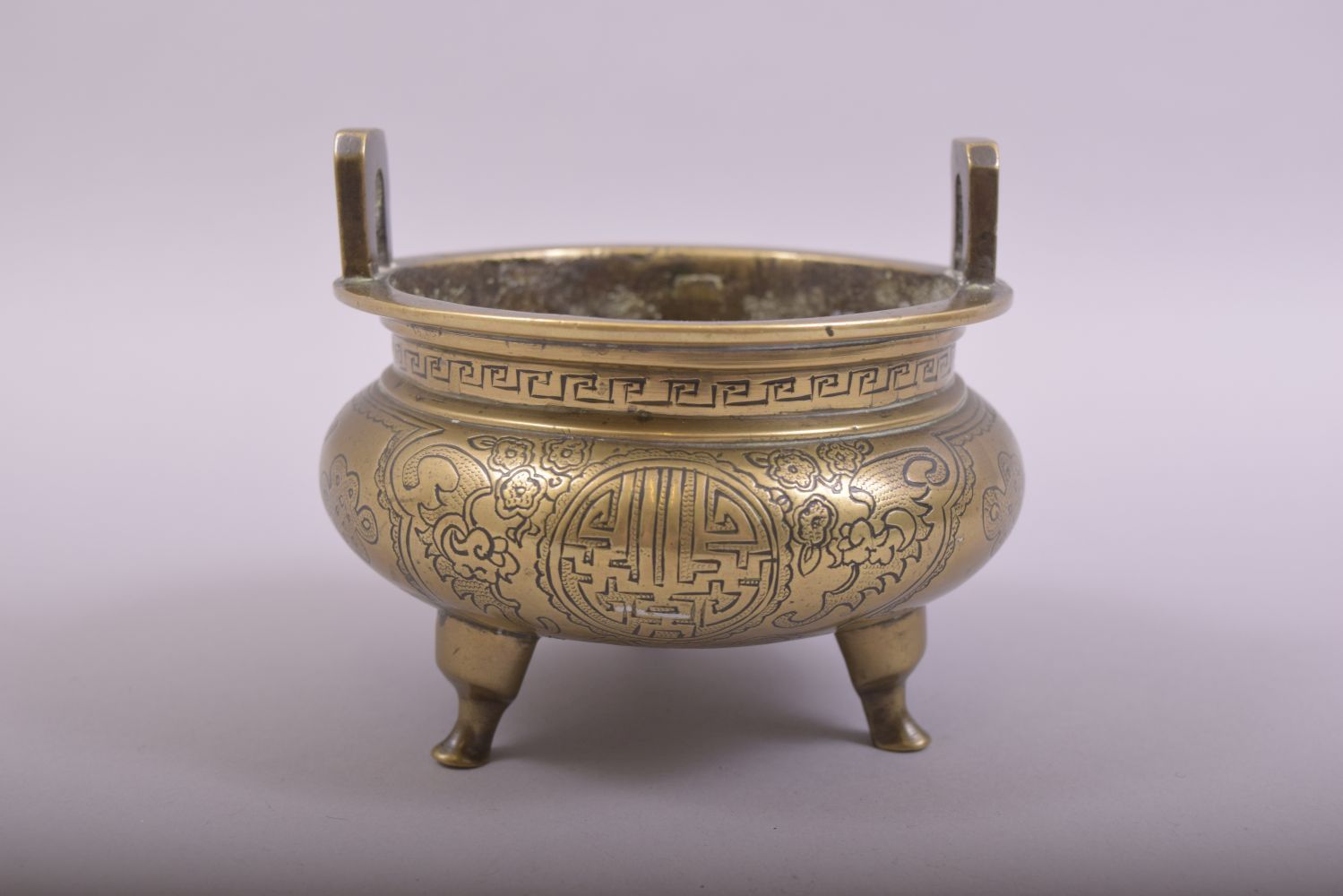 A CHINESE BRONZE TWIN HANDLE TRIPOD CENSER, with engraved and chased decoration, the base with six- - Image 3 of 7