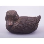 A JAPANESE CARVED WOOD MODEL OF A DUCK, with inlaid eyes and inset seal mark, 8.5cm long.