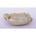 A GOOD 19TH CENTURY CHINESE CARVED JADE BRUSH WASHER, in form of a lily and lotus root, 9cm wide.