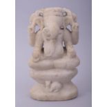 A 17TH/18TH CENTURY INDIAN CARVED MARBLE GANESHA, 18.5cm high.