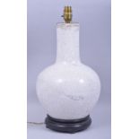 A CHINESE CRACKLE GLAZE LAMP VASE, mounted to a hardwood base, overall height 42cm.