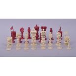 A MIXED LOT OF CARVED IVORY CHESS PIECES, comprising 16 white pieces and 14 stained red pieces.