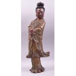 A CHINESE CARVED WOOD LACQUERED STANDING FIGURE OF GUANYIN, 57cm high.