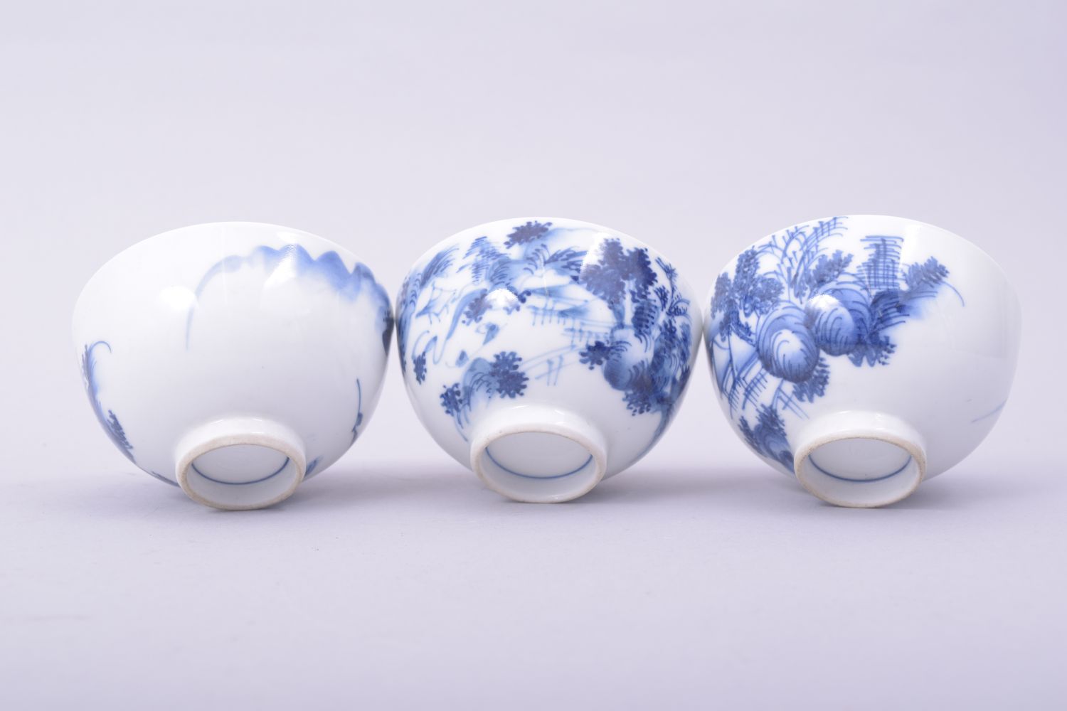 THREE CHINESE BLUE AND WHITE PORCELAIN TEA BOWLS, each painted with a landscape scene, 7.5cm - Image 6 of 6