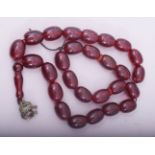 A CHERRY AMBER BAKELITE LARGE BEADED NECKLACE.