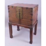 A CHINESE HARDWOOD CASKET ON STAND, with brass fittings and pin lock with key, casket 28cm high,