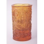 A CHINESE AMBER TINTED CUT GLASS BRUSH POT, 13cm high.