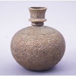 A FINE INDIAN BRASS GLOBULAR HUQQA BASE, with embossed floral decoration, 16cm high.